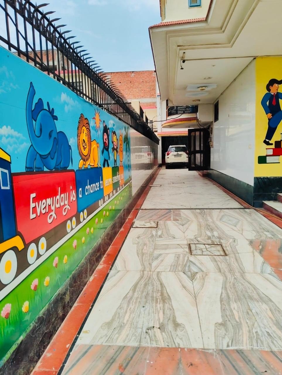 Prakriti school corridor with colourful mural
