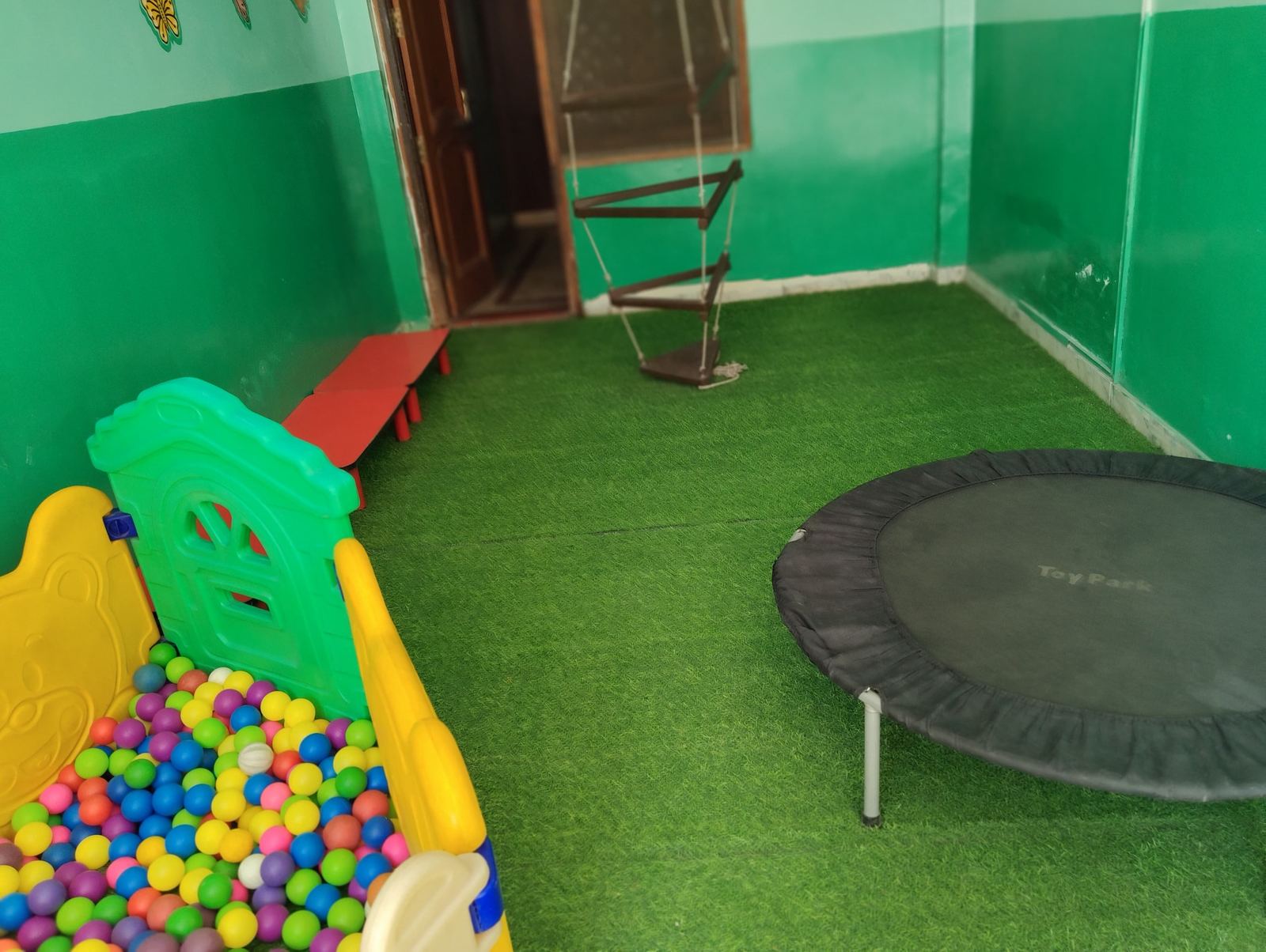 Prakriti outdoor turf play area with ball pit and trampoline