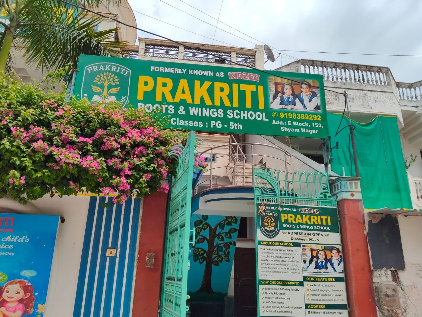 Prakriti - Roots & Wings School entrance signboard